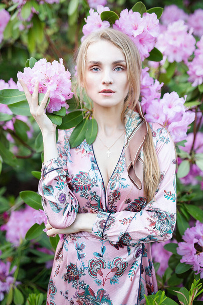 Young fashion girl in the garden - Фото, зображення