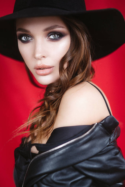 Fashion girl in black hat. - Фото, изображение