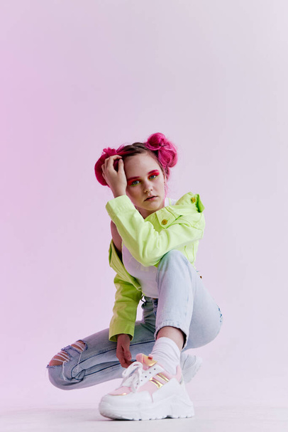 woman with pink hair teen fashionable clothes posing neon - 写真・画像