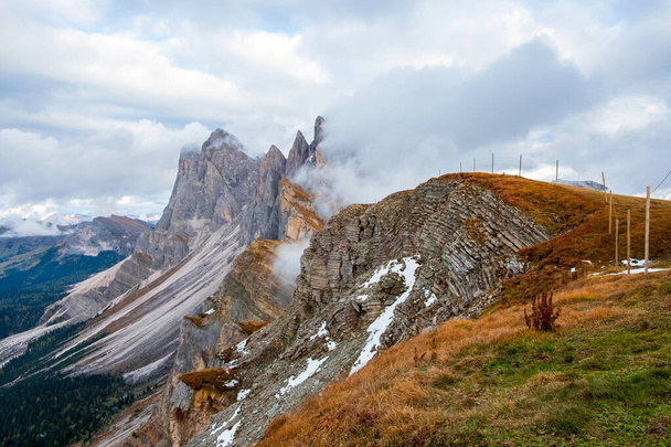 Beautiful panorama of Mount Seceda and Odle, surrounded by magnificent mountain ranges near the town of Ortisei in the Dolomites, Val Gardena, South Tyrol in Italy - Photo, Image