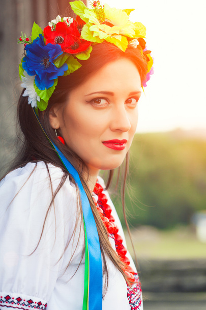 Woman wearing national ukrainian clothes outdoors - Photo, Image