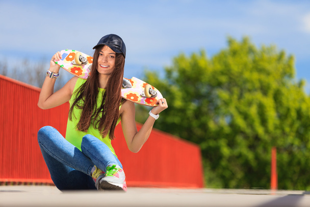 Summer sport. Cool girl skater with skateboard - Photo, Image