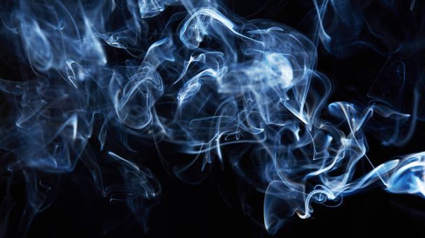 smoke on black background with abstract blur motion wave swirl . Wisp of Smoke. Cigarette smoke waves and clouds  texture - Фото, зображення