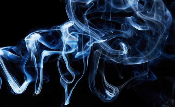 blue smoke on black background with abstract blur motion wave swirl . Wisp of Smoke. Cigarette smoke waves and clouds texture - Foto, Imagem