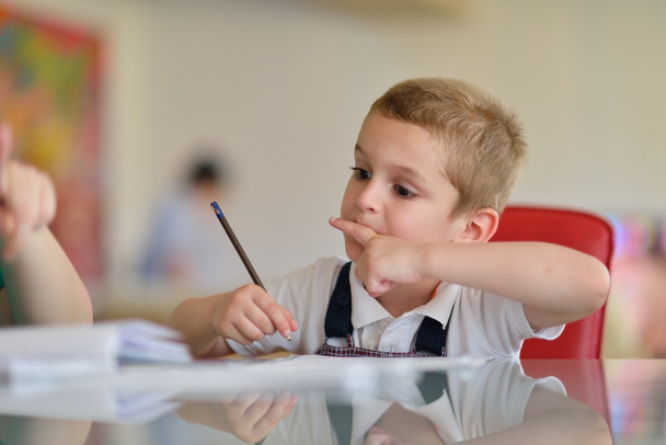 Boy doing homework - Foto, Bild