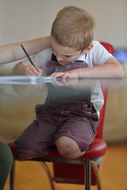 Boy doing homework - Фото, зображення