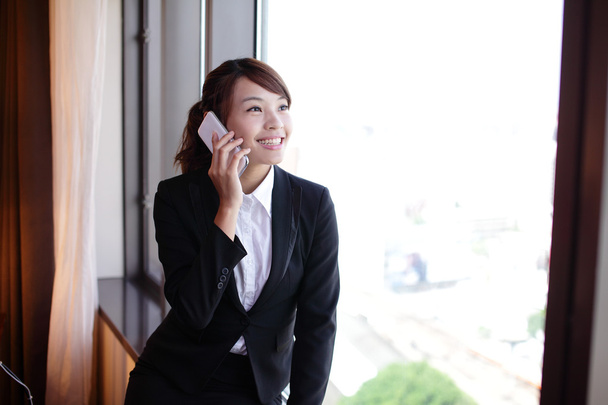 Young business woman speaking smart phone - Fotó, kép