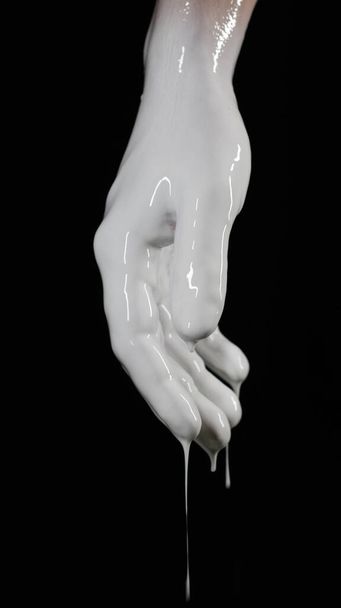 a drenched hand on a black background hangs down - Zdjęcie, obraz