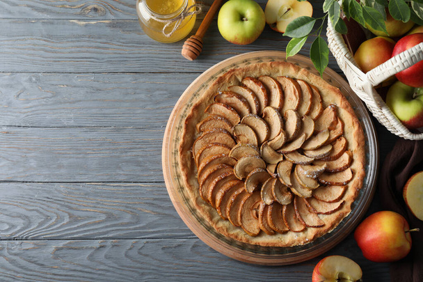 Concept of tasty food with apple pie on wooden background - Zdjęcie, obraz