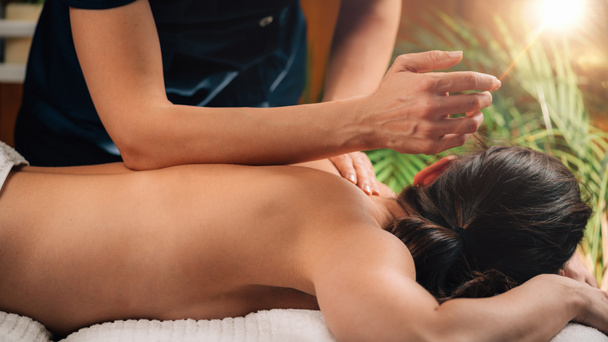 Deep Tissue Massage Therapy. Therapist massaging Womans Back, using Elbow Pressure.  - Valokuva, kuva