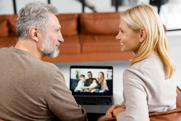 Middle-aged couple using laptop computer for video connection - Foto, immagini