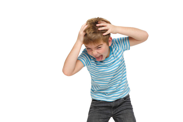 Little boy in striped clothes shouts emotionally with his head in his hands isolated on white background. - Foto, Bild