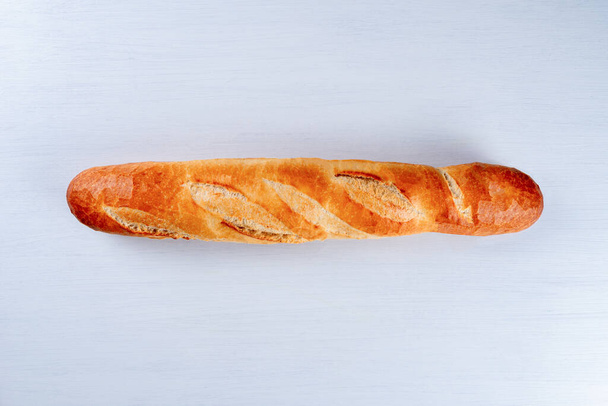 freshly baked baguette isolated on white background, top view. - Fotó, kép