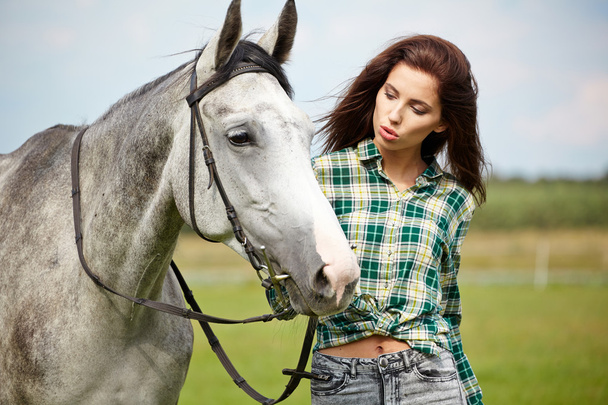 Woman with a white horse  - Foto, Imagen