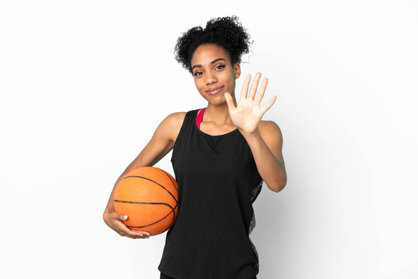 Young basketball player latin woman isolated on white background counting five with fingers - Foto, Imagem
