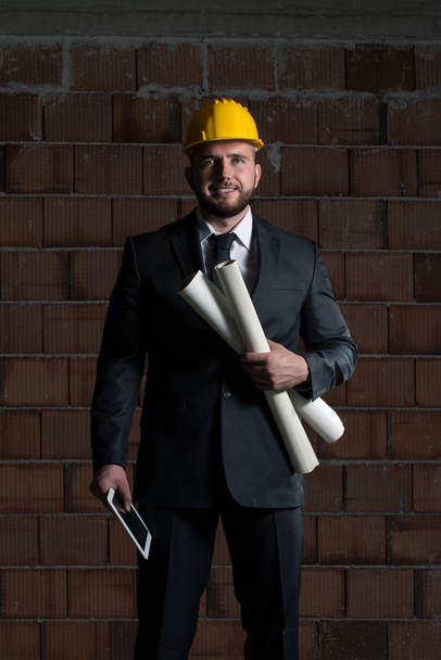 Caucasian Male Construction Manager With Blueprint - Foto, imagen