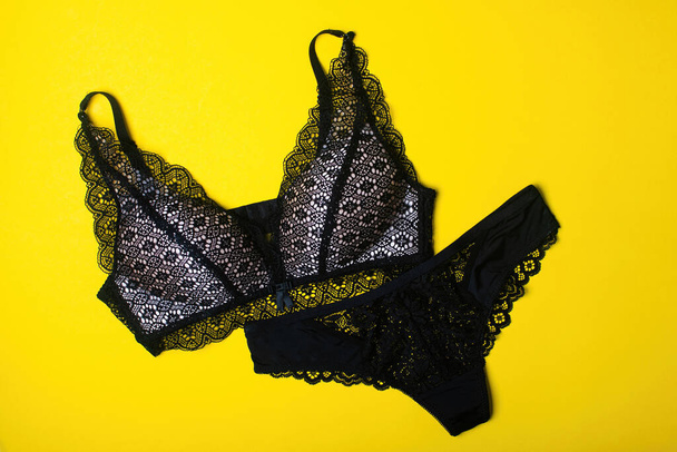 Beautiful black sports top bra and panties - thongs. Black lace lingerie. - Fotoğraf, Görsel