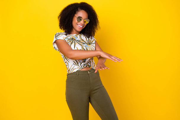 Photo of young pretty afro girl have fun dance hands party cool isolated over yellow color background - Φωτογραφία, εικόνα