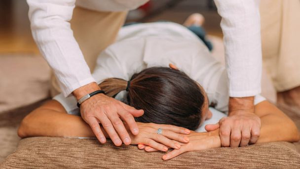 Shiatsu arms and shoulder massage. Therapist massaging the small and large intestine meridians. - Zdjęcie, obraz