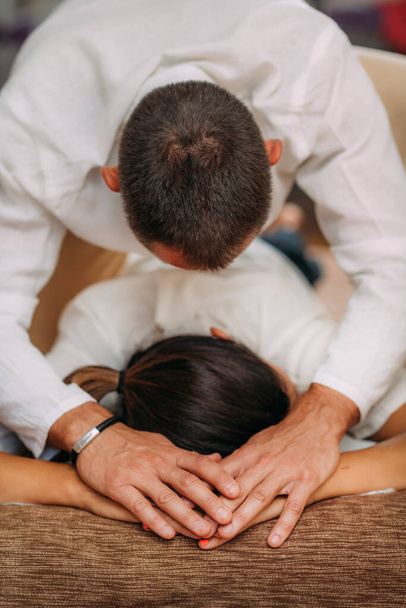 Shiatsu arms and shoulder massage. Therapist massaging the small and large intestine meridians. - Foto, afbeelding