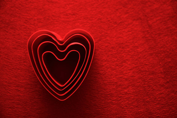 red material background with many forms of heart symbols. 14th february - Photo, Image