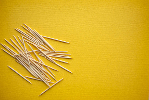Wooden toothpicks on light background. place for text - Photo, Image