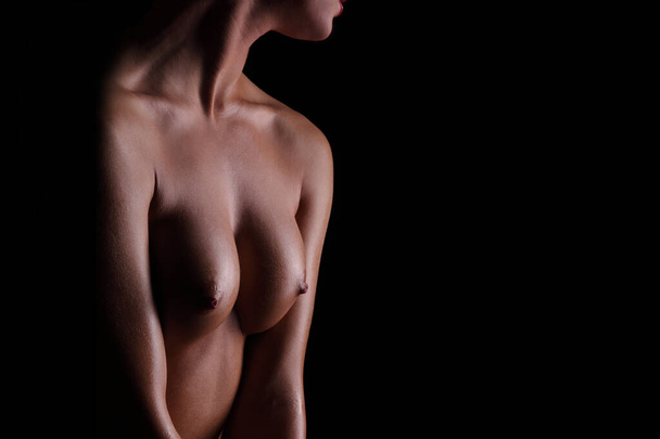 young sexy nude woman on a black background - Photo, Image