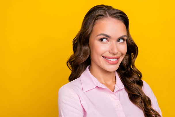 Photo of journalist millennial brunette lady look empty space wear pink shirt isolated on yellow color background - Φωτογραφία, εικόνα