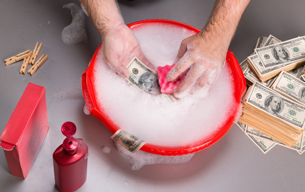 Hands are washing dollars in foam - Zdjęcie, obraz
