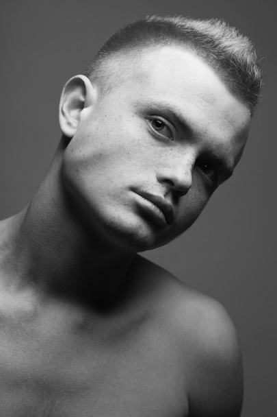Male beauty concept. Portrait of fashionable and undressed young - Fotó, kép