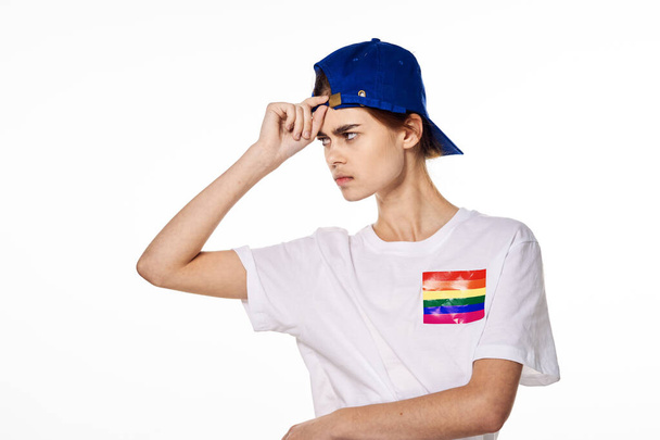 girl in white t-shirt lgbt flag transgender posing light background - Фото, изображение
