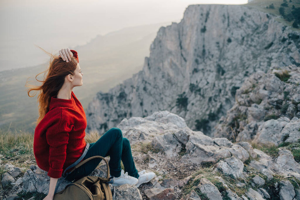woman hiker sitting on mountain landscape nature fresh air - Fotó, kép