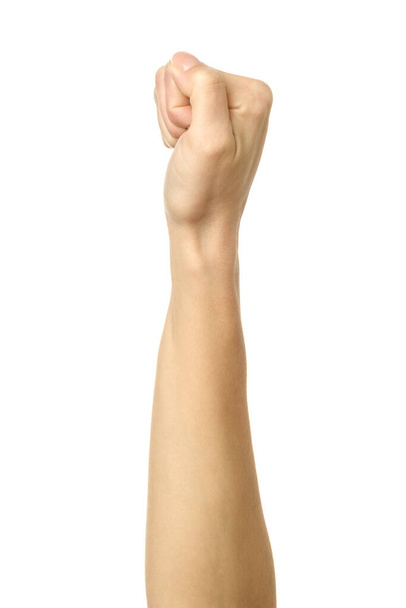 Handgebald in een vuist. Verticaal beeld. Vrouw hand met Franse manicure gebaar geïsoleerd op witte achtergrond. Deel van serie - Foto, afbeelding
