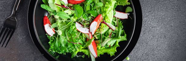 salad crab stick lettuce leaves mix green fresh meal snack copy space food background rustic. top view  - Foto, Imagen