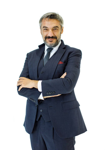 Cutout portrait of old healthy Caucasian senior businessman on smart dark blue suits and necktie confidently standing with crossed arms and happily smiling for job success - Foto, afbeelding
