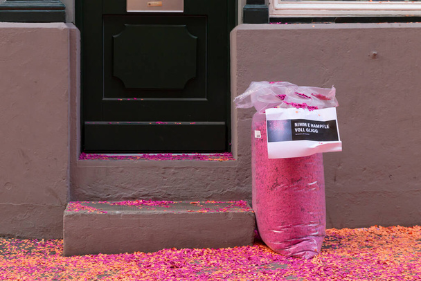 Basel, Switzerland - February 21. Close-up of a bag filled with pink confetti - Фото, изображение