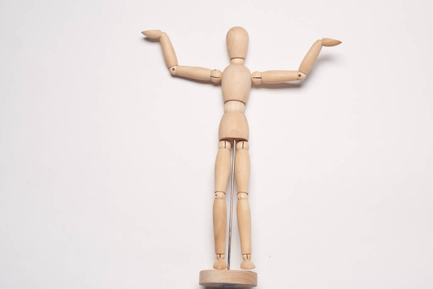 wooden mannequin toy object posing design light background - Fotografie, Obrázek