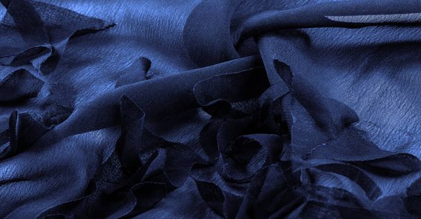 Textur. Hintergrund. blauer Seidenstoff, Draufsicht. Glatte, elegante Textur aus blauer Seide oder Satin kann als abstrakter Hintergrund mit Kopierraum verwendet werden. - Foto, Bild