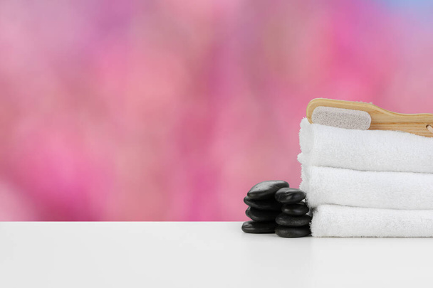 Spa still life with stacked stones and towels - Фото, изображение