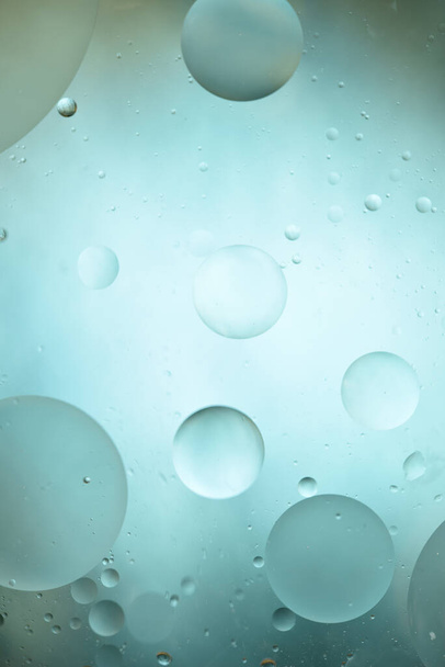 Oil circles on a colored abstract background. Like the solar system.  - Photo, Image