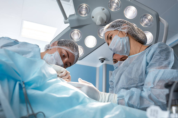 The medical team performs the operation - a series of images related to the surgery. Real modern, operating fee, struggle for life - Fotografie, Obrázek