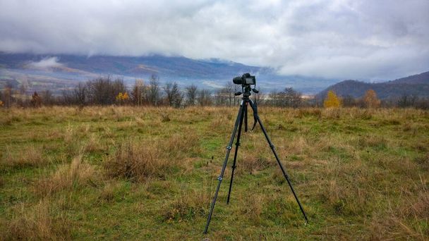 Shooting with a camera of an autumn landscape with fog in a mountainous area - Photo, Image