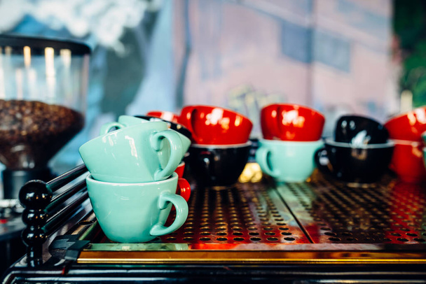 A closeup of the colorful ceramic coffee cups in the cafe - Fotografie, Obrázek