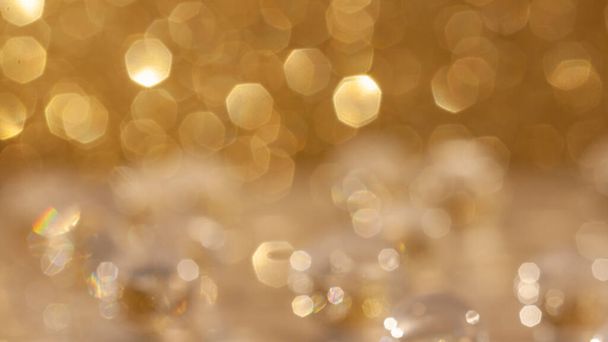 Abstract bright yellow golden metallic look. Blurred bokeh background, no props. Backdrop for overlay, greeting cards or montage, copy space. - Фото, изображение