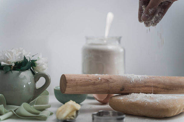 A selective of wooden rolling pin and flour on a table for baking - Foto, imagen