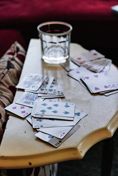 A high angle shot of some cards on a table in the morning after a party - Fotoğraf, Görsel