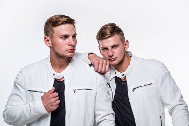 twin brothers men in white casual clothes look alike, identically - Fotoğraf, Görsel