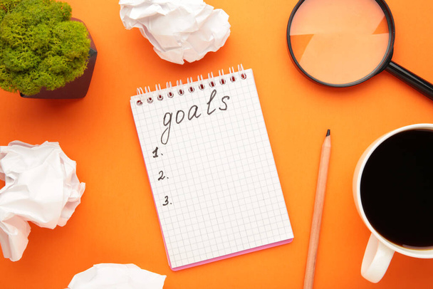 My Goals as memo on notebook with cup of coffee on orange background. Top view. - Фото, изображение