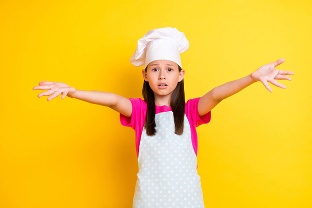 Photo of helpless troubled desperate girl plead assistance wear white apron hat isolated yellow color background - Photo, image