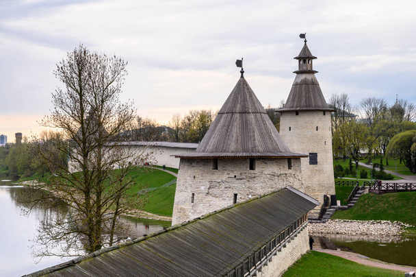 Flat and High towers. Historic site in Pskov. Fortress wall. Pskov Krom. It is a nasty day. - Photo, Image